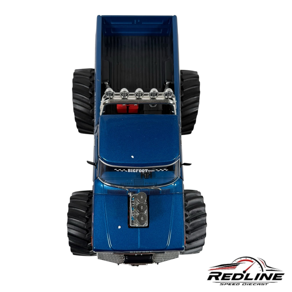 Top view of a blue 1:18 scale Bigfoot 1974 Ford F-250 monster truck diecast model with oversized treaded tires.