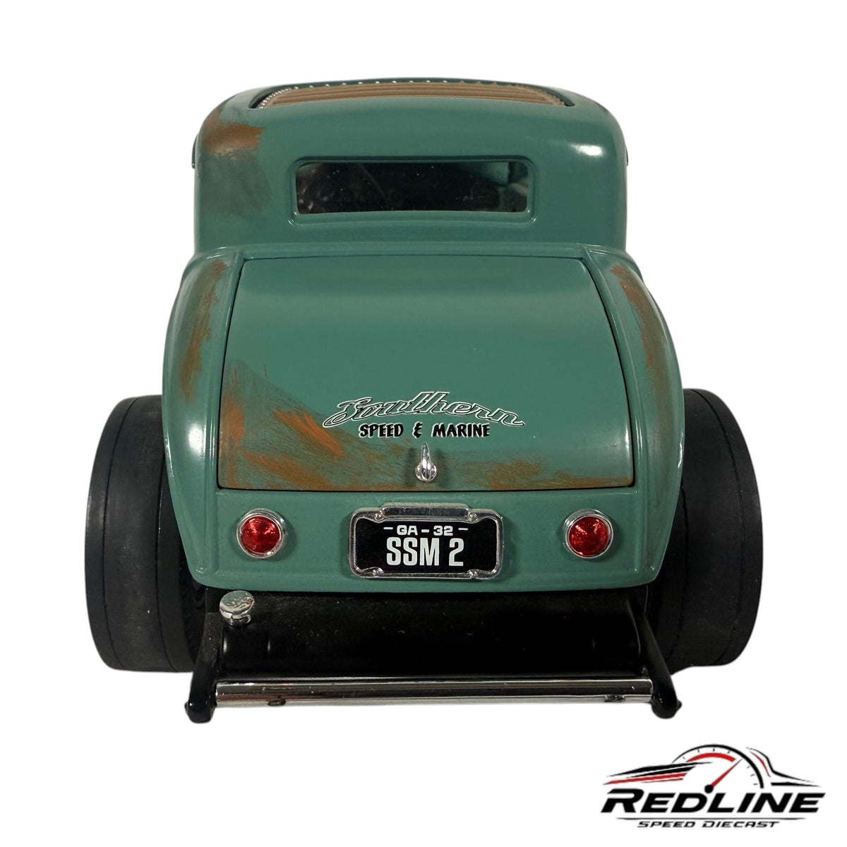 Rear view of a green 1932 Ford hot rod diecast model with weathered rust details and Southern Speed & Marine branding.