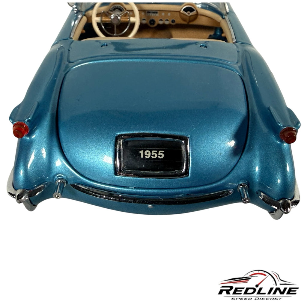Redline Speed Diecast 1955 Chevrolet Corvette model in metallic blue, rear view showing chrome trim and interior.