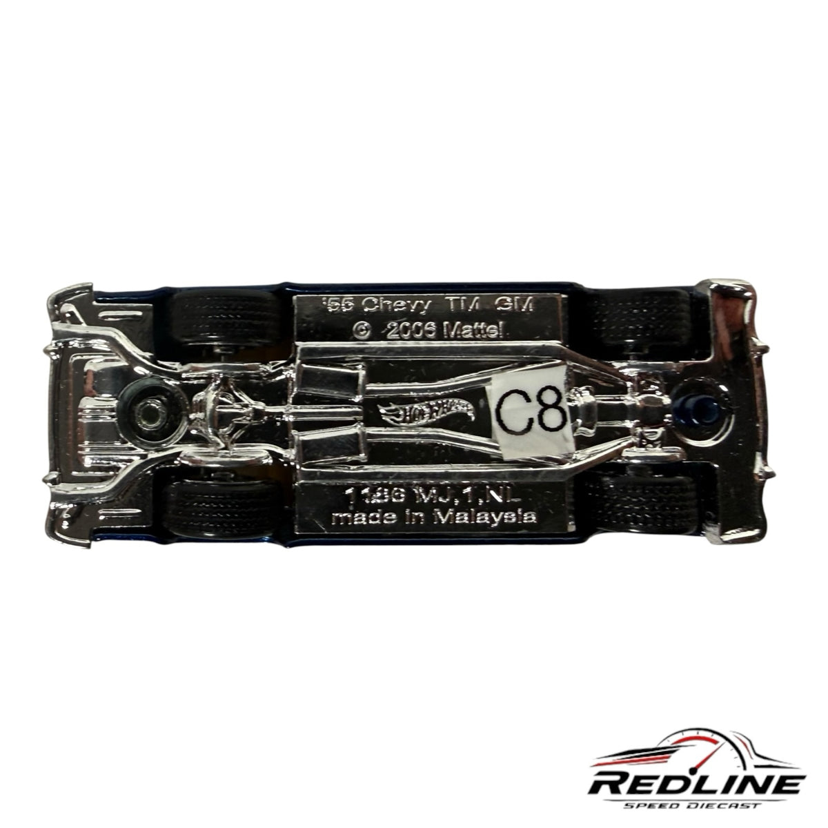 Underside view of a Redline Speed Diecast 1955 Chevrolet Bel Air model car showing chrome chassis and wheel details