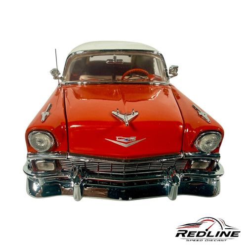 Redline Speed Diecast 1956 Chevrolet Nomad model car in red and white with chrome detailing, front view.