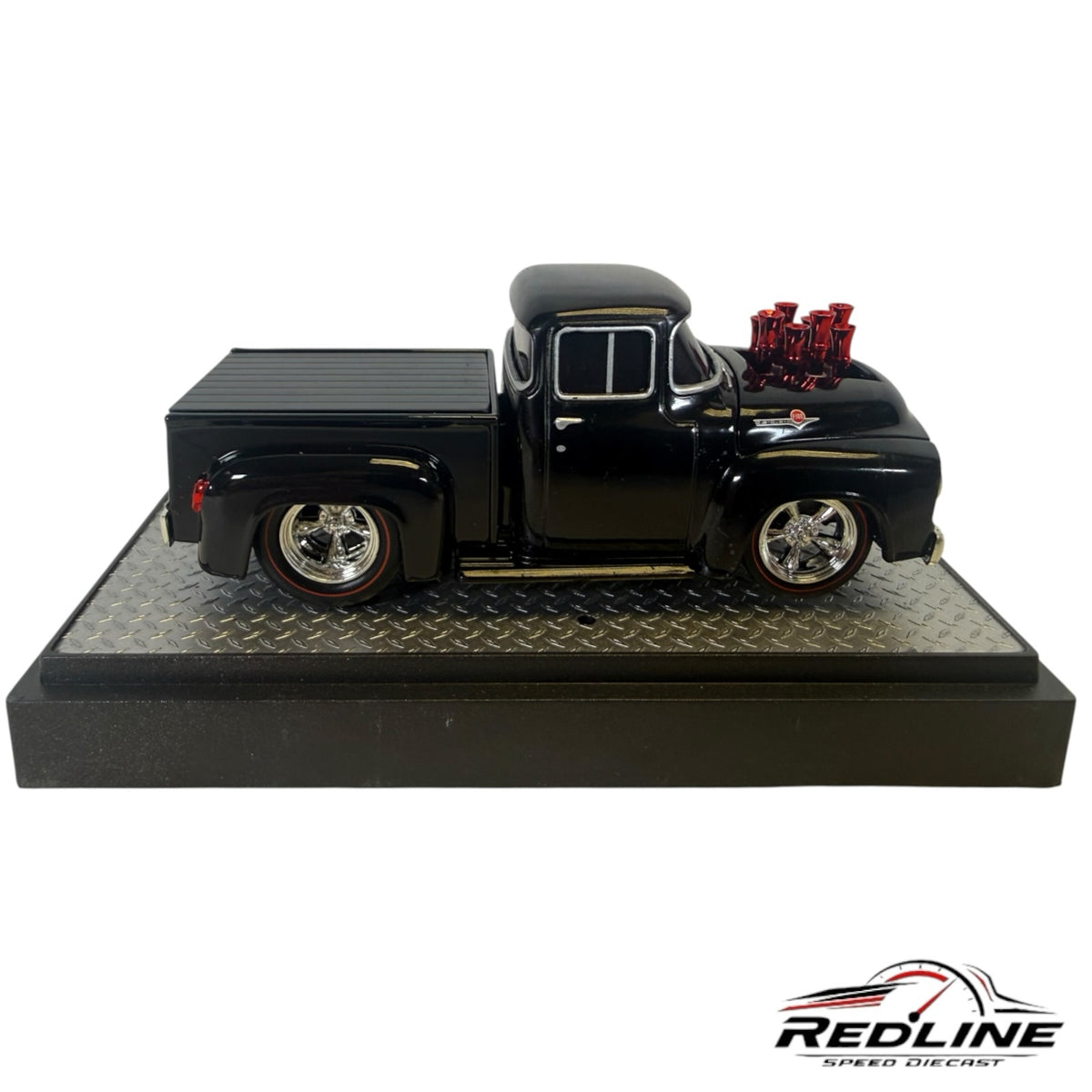 Redline Speed Diecast 1956 Ford F-100 black street-rod pickup model with red engine stacks on a display base