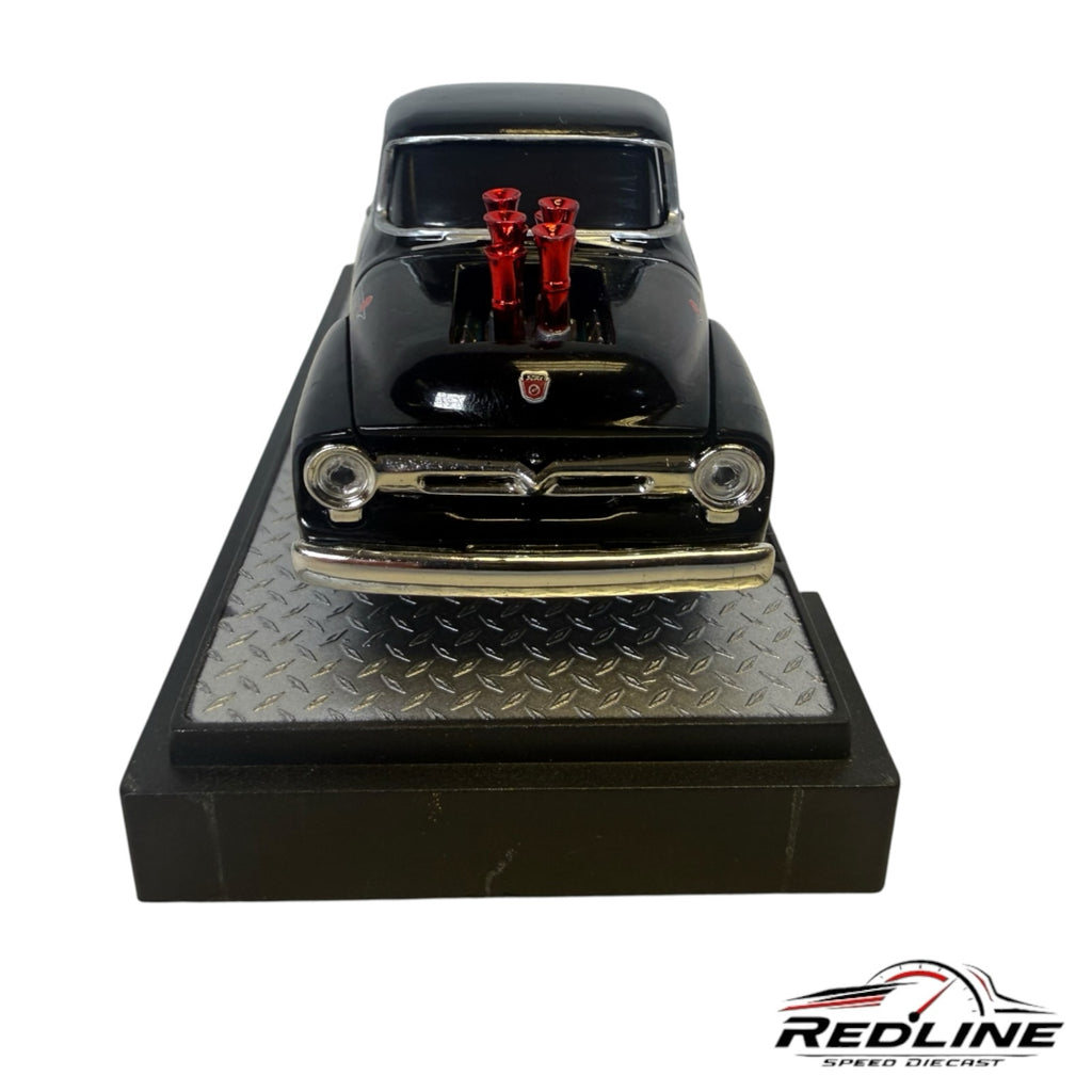 Redline Speed Diecast 1956 Ford F-100 black street-rod model with red engine stacks on a diamond-plate display base
