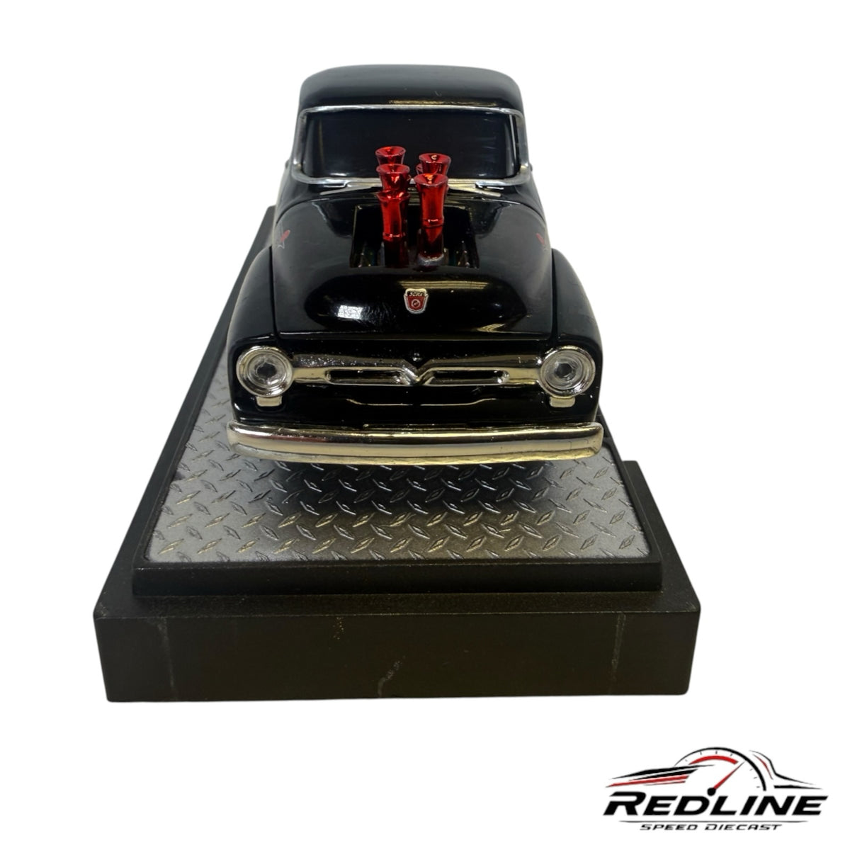 Redline Speed Diecast 1956 Ford F-100 black street-rod model with red engine stacks on a diamond-plate display base