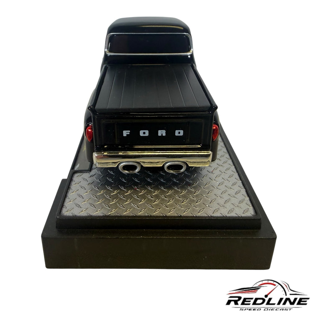 Redline Speed Diecast 1956 Ford F-100 black pickup truck model on a diamond-plate display base, rear view.