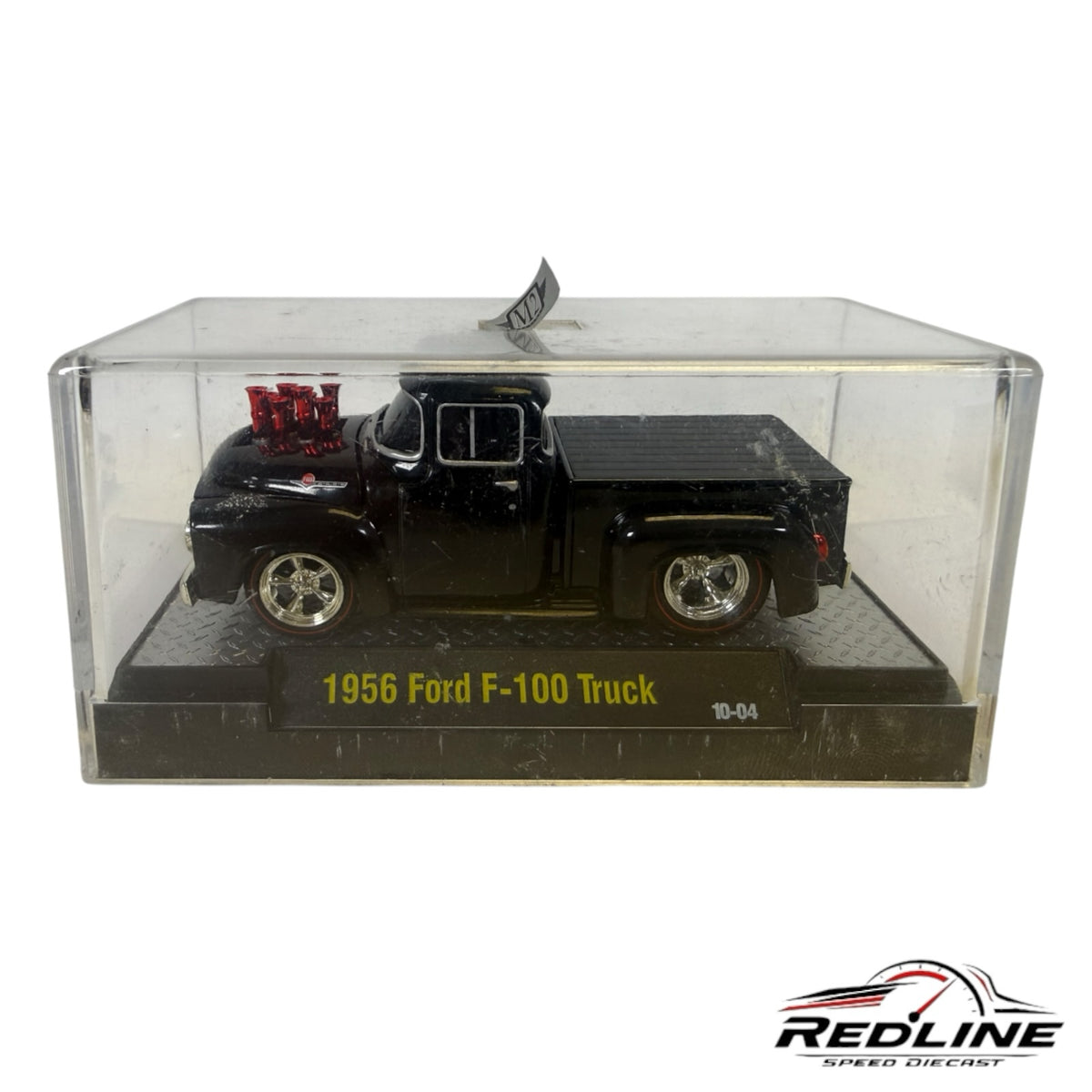 Redline Speed Diecast 1956 Ford F-100 black custom street-rod pickup truck model in a clear display case.