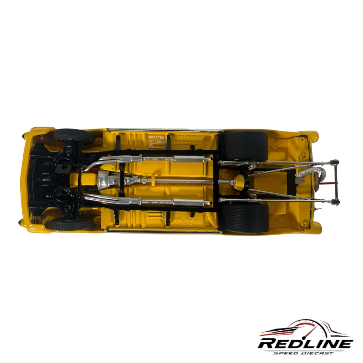 Undercarriage view of a Redline Speed Diecast 1957 Chevrolet Pro Street model featuring detailed exhaust and suspension