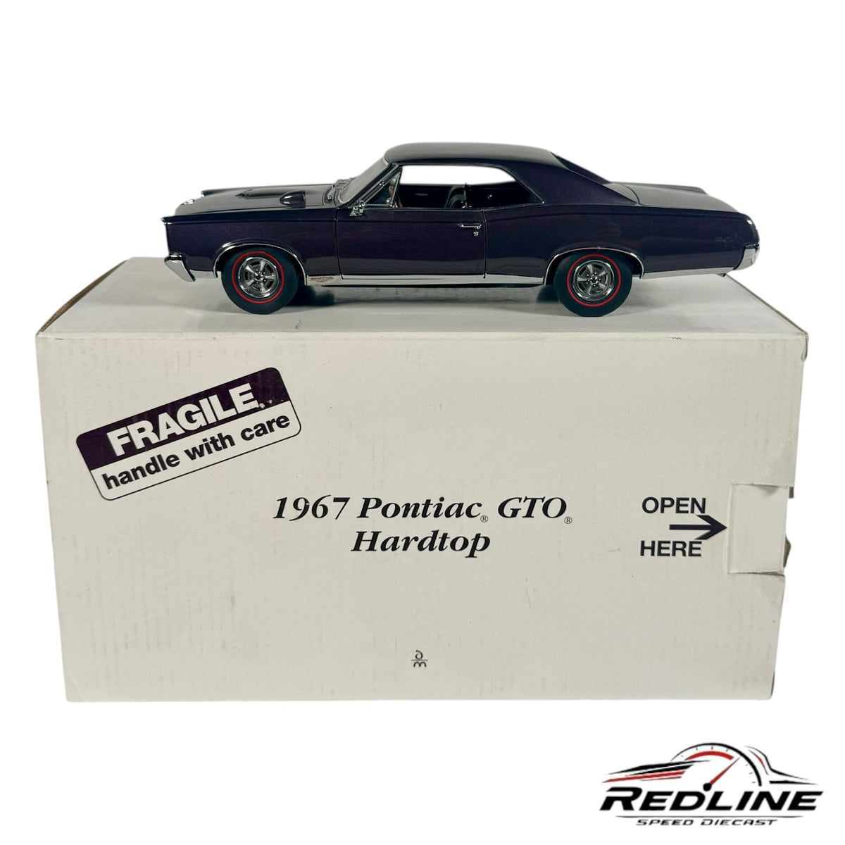 Redline Speed Diecast 1967 Pontiac GTO hardtop model car in dark purple metallic with red-line tires on its display box