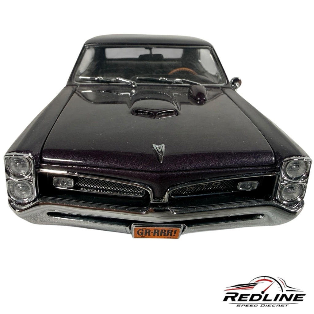 Redline Speed Diecast 1967 Pontiac GTO hardtop model in dark purple metallic with signature split grille and headlights