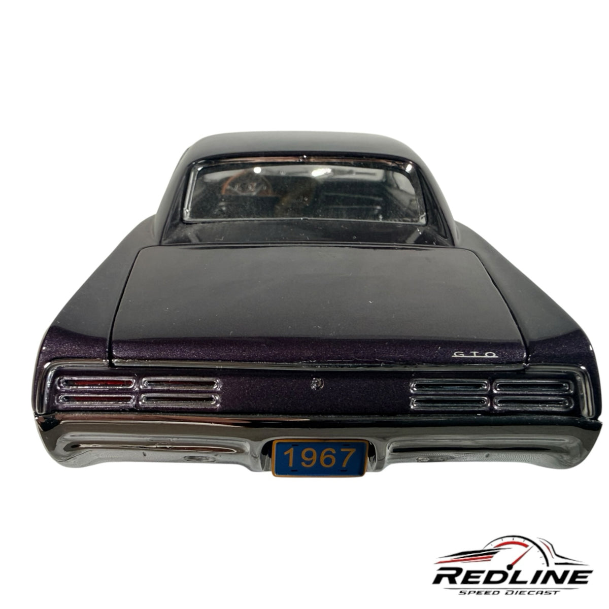 Redline Speed Diecast 1967 Pontiac GTO hardtop model car in dark purple metallic, rear view with 1967 license plate.