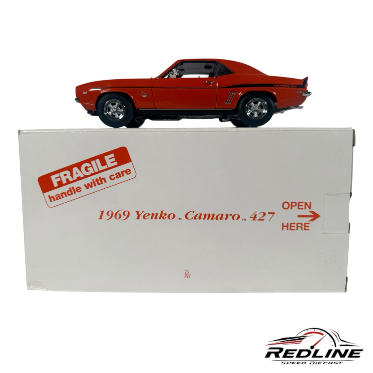 Redline Speed Diecast 1969 Yenko Camaro 427 model car in Hugger Orange with black stripes on its original display box