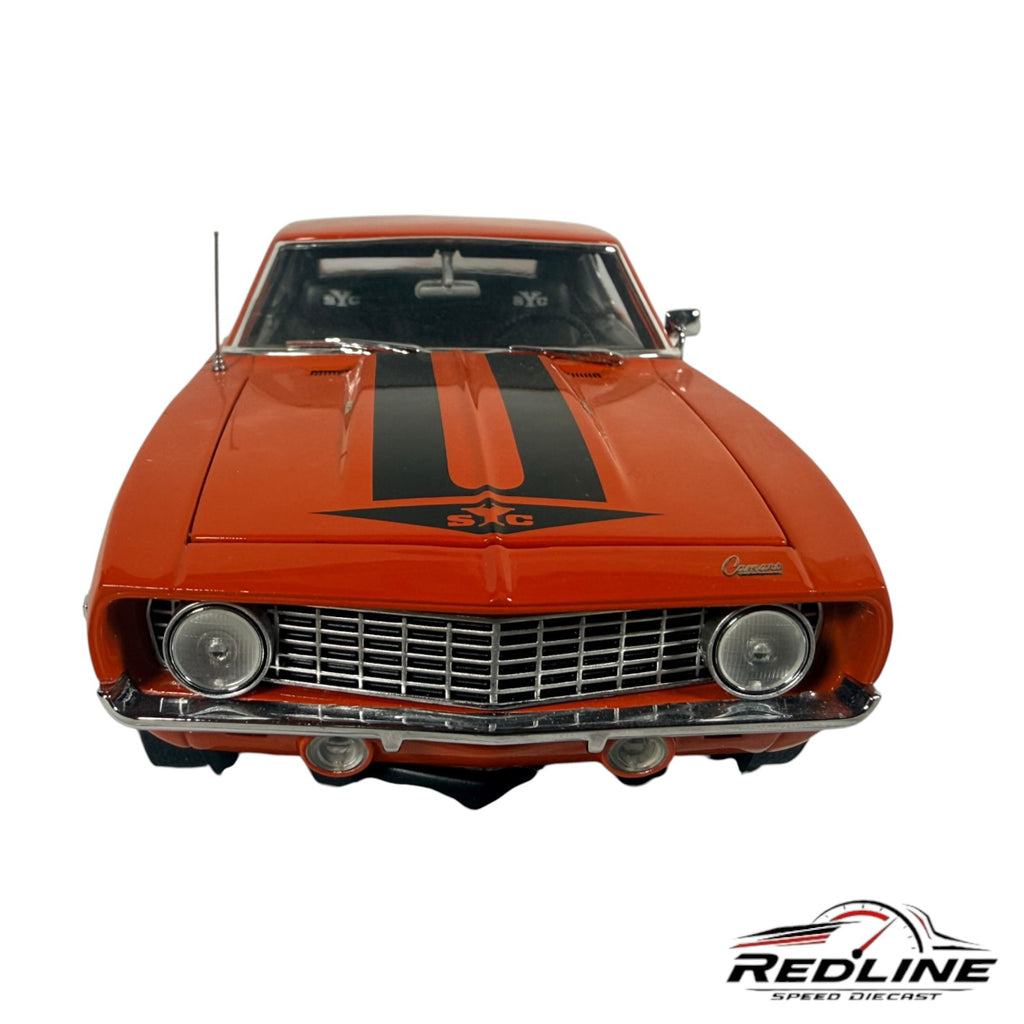 Redline Speed Diecast 1969 Yenko Camaro model in Hugger Orange with black racing stripes and chrome grille front view
