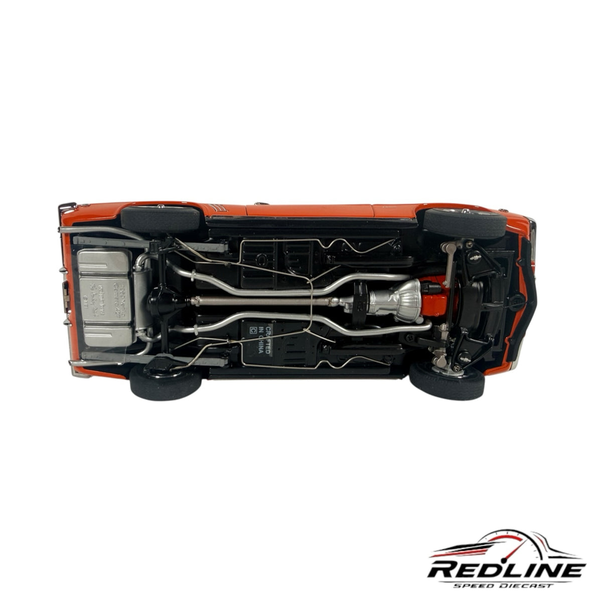 Underside view of a Redline Speed Diecast 1969 Yenko Camaro model showing detailed chassis, exhaust, and drivetrain.