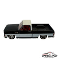 Redline Speed Diecast 1973 Chevrolet C10 pickup truck model in black and silver with a red interior and custom wheels.