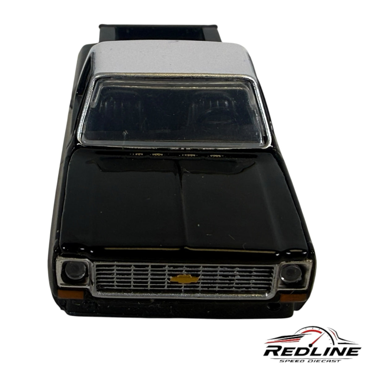 Redline Speed Diecast 1973 Chevrolet Cheyenne 10 model truck in black and silver with chrome grille front view