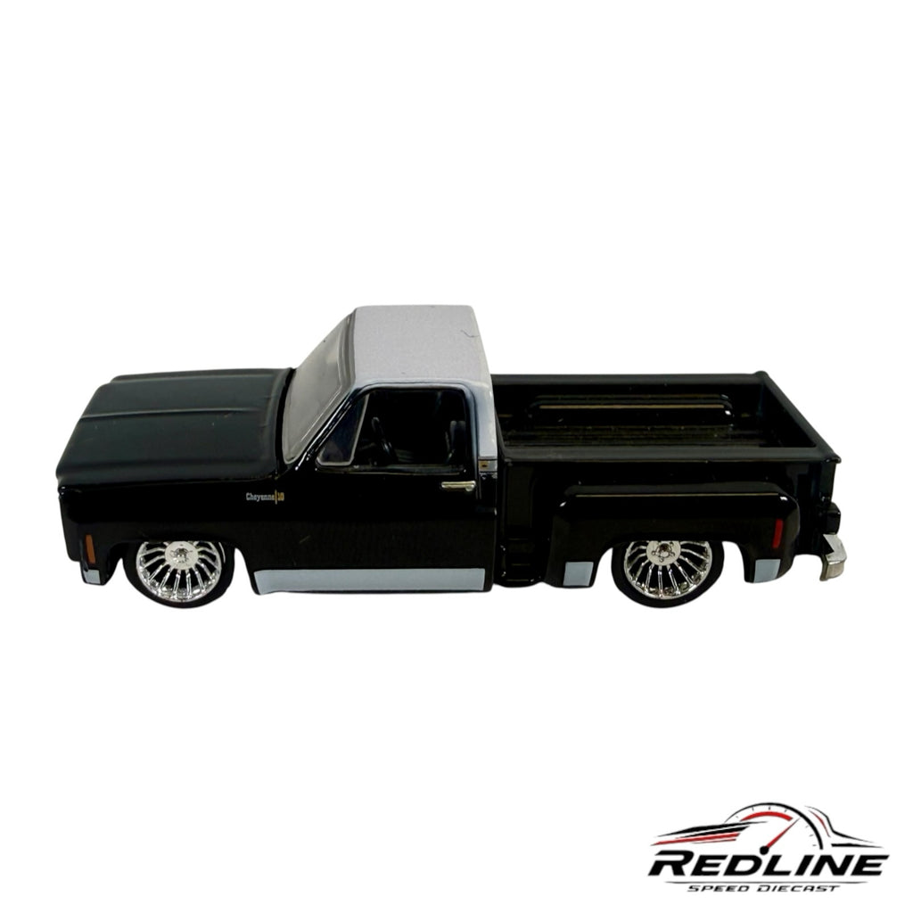 Redline Speed Diecast 1973 Chevrolet Cheyenne 10 model truck in black and silver with custom chrome wheels