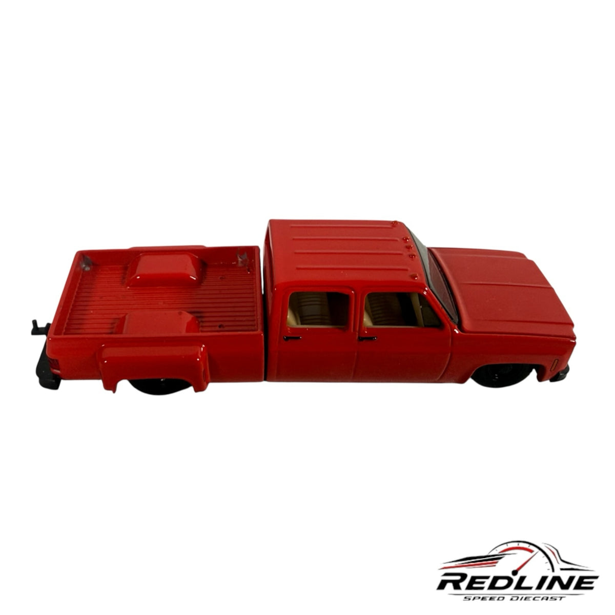 Redline Speed Diecast 1973 Chevrolet crew cab dually pickup truck model in glossy red with a tan interior