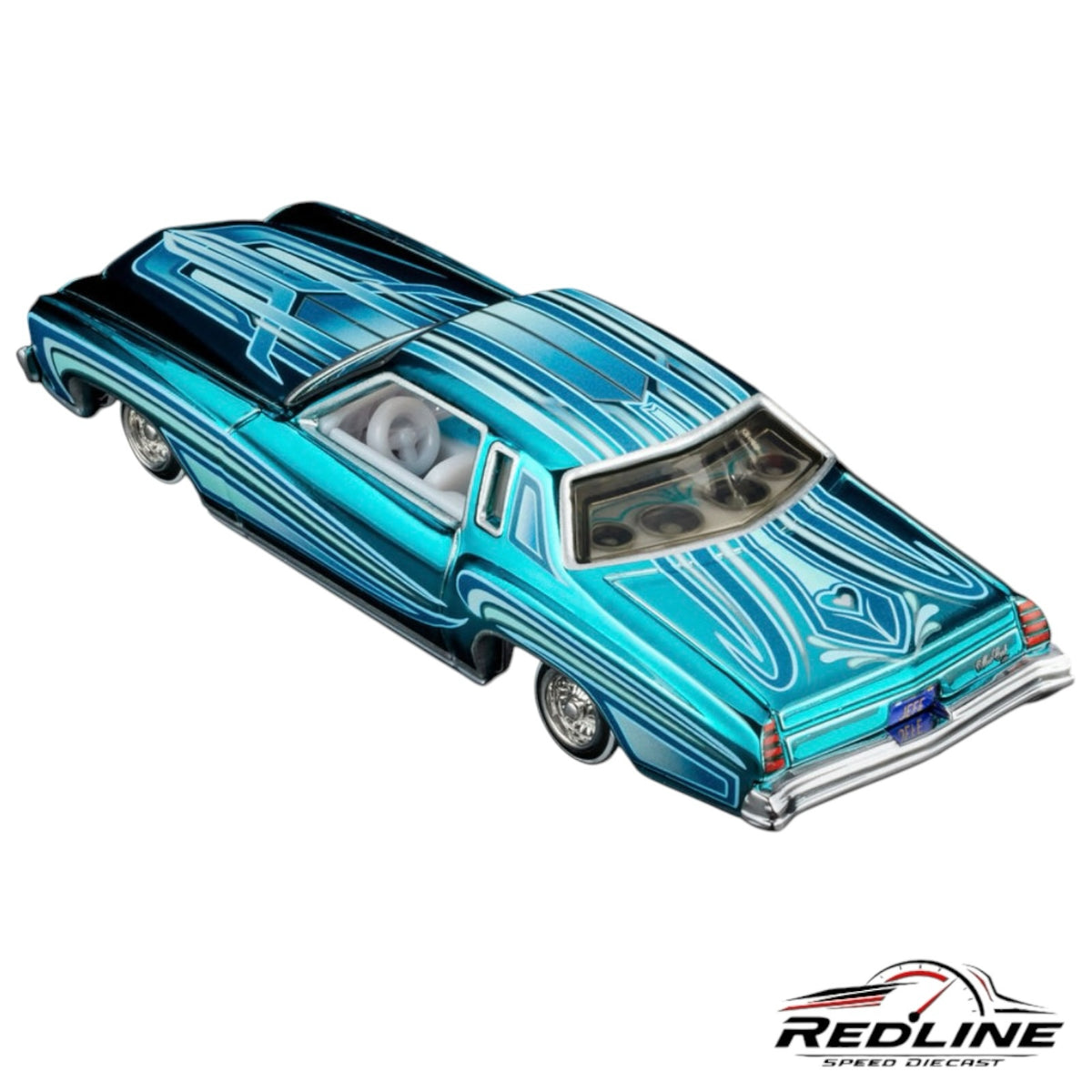 Redline Speed Diecast 1975 Chevrolet Monte Carlo lowrider model in teal and blue with intricate pinstriping details.