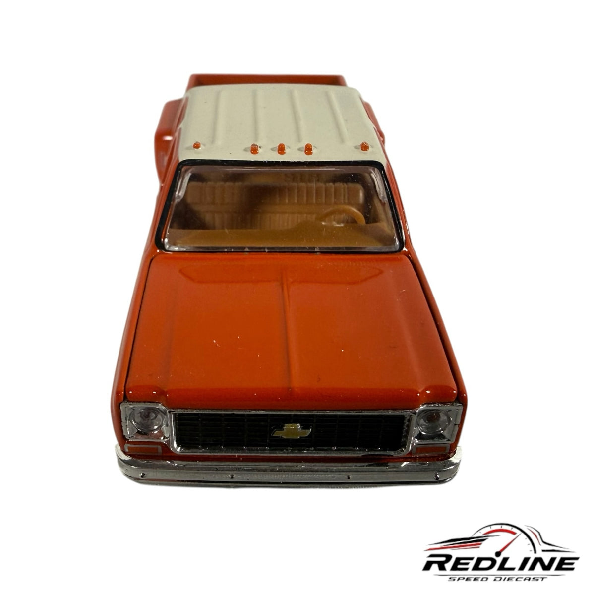 Redline Speed Diecast 1977 Chevrolet C30 dually pickup truck model in two-tone orange and white with tan interior