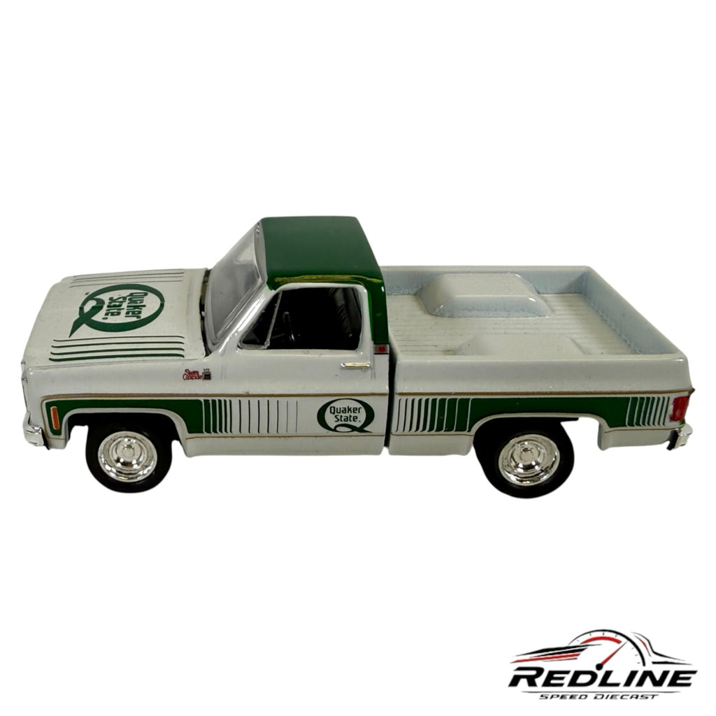 Redline Speed Diecast 1977 GMC Sierra Grande pickup truck model in white and green with Quaker State branding.