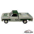 Redline Speed Diecast 1977 GMC Sierra Grande pickup truck model in white and green with Quaker State branding.