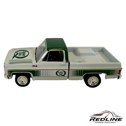Redline Speed Diecast 1977 GMC Sierra Grande pickup truck model in white and green with Quaker State branding.