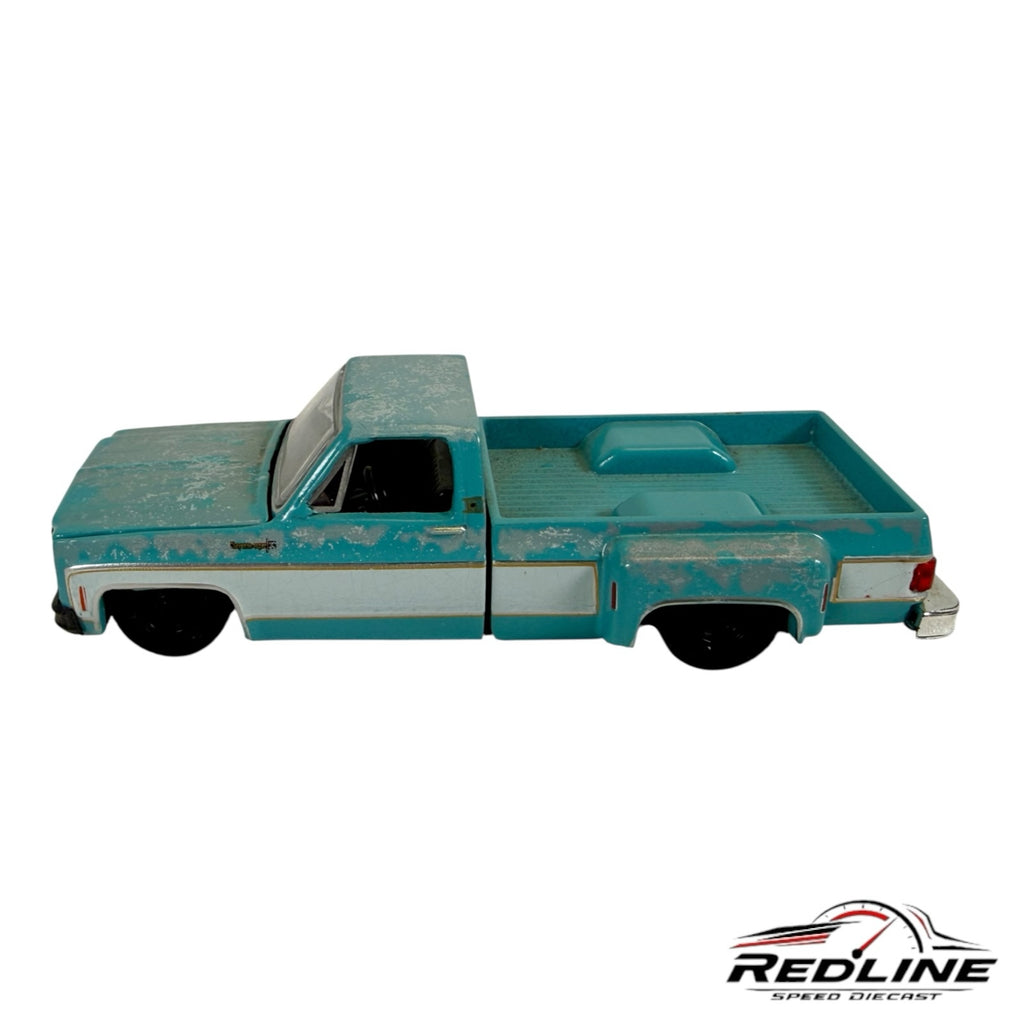 Redline Speed Diecast 1978 Chevrolet pickup truck model in distressed teal and white with a weathered finish