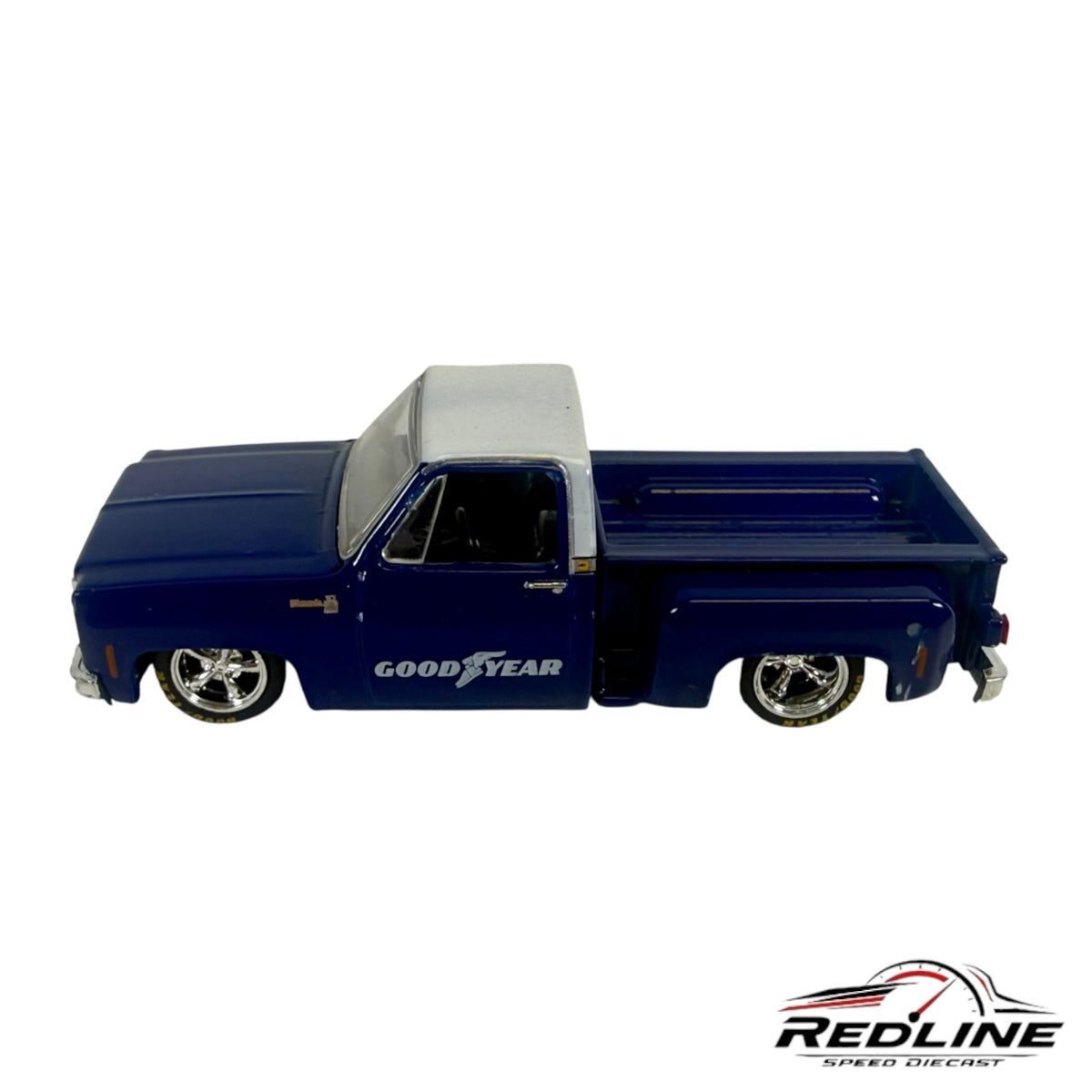 Redline Speed Diecast 1979 Chevrolet C10 stepside pickup truck model in deep blue with a silver roof and chrome wheels.