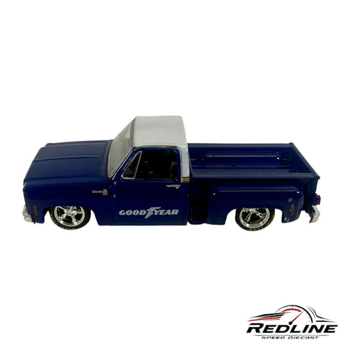 Redline Speed Diecast 1979 Chevrolet C10 stepside pickup truck model in deep blue with a silver roof and chrome wheels.