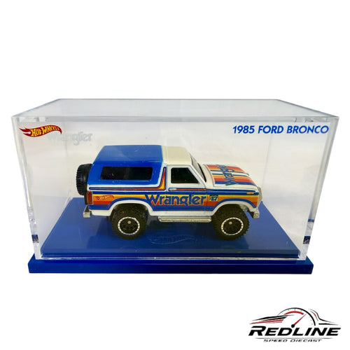 Redline Speed Diecast 1985 Ford Bronco Hot Wheels model in blue and white with Wrangler branding in display case