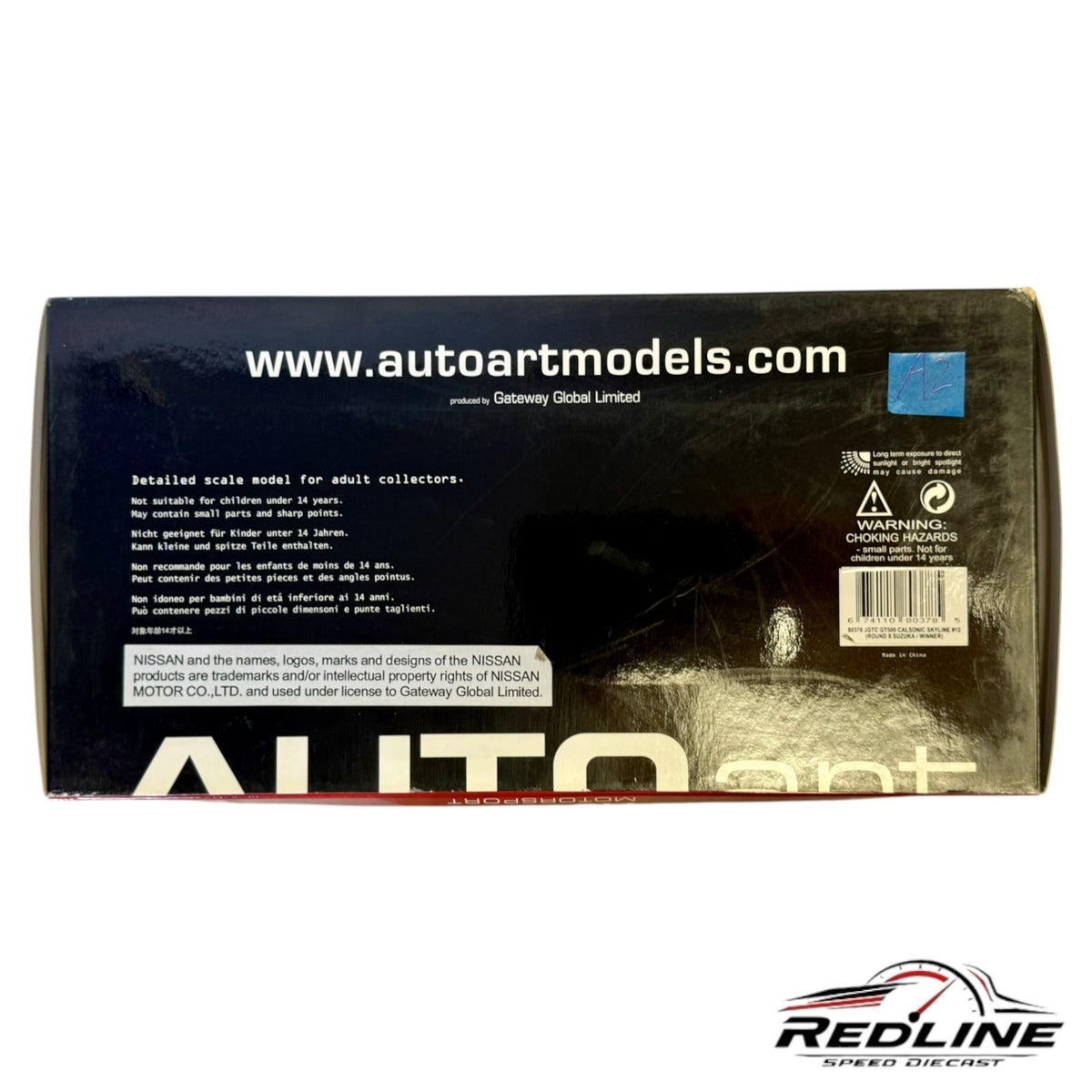 Redline Speed Diecast AUTOart model car packaging box with safety warnings and branding on a white background
