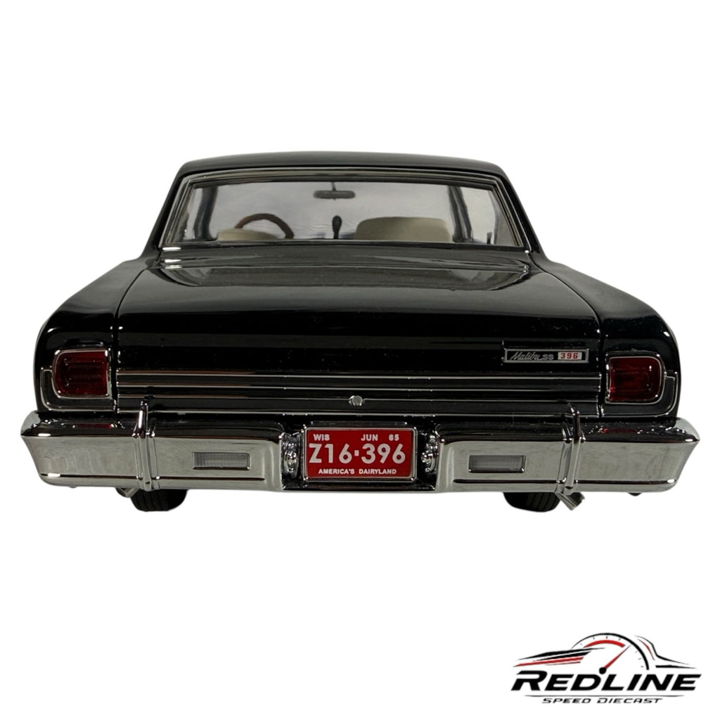 Rear view of a black 1965 Chevrolet Chevelle Z16 diecast model by Redline Speed Diecast with chrome bumper and license