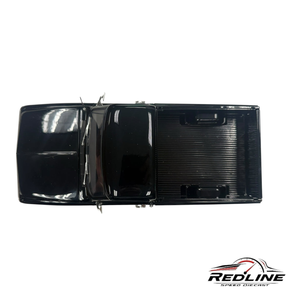 Redline Speed Diecast 1970 Chevrolet K-10 pickup truck model in glossy black, top-down view of the truck bed and cab.