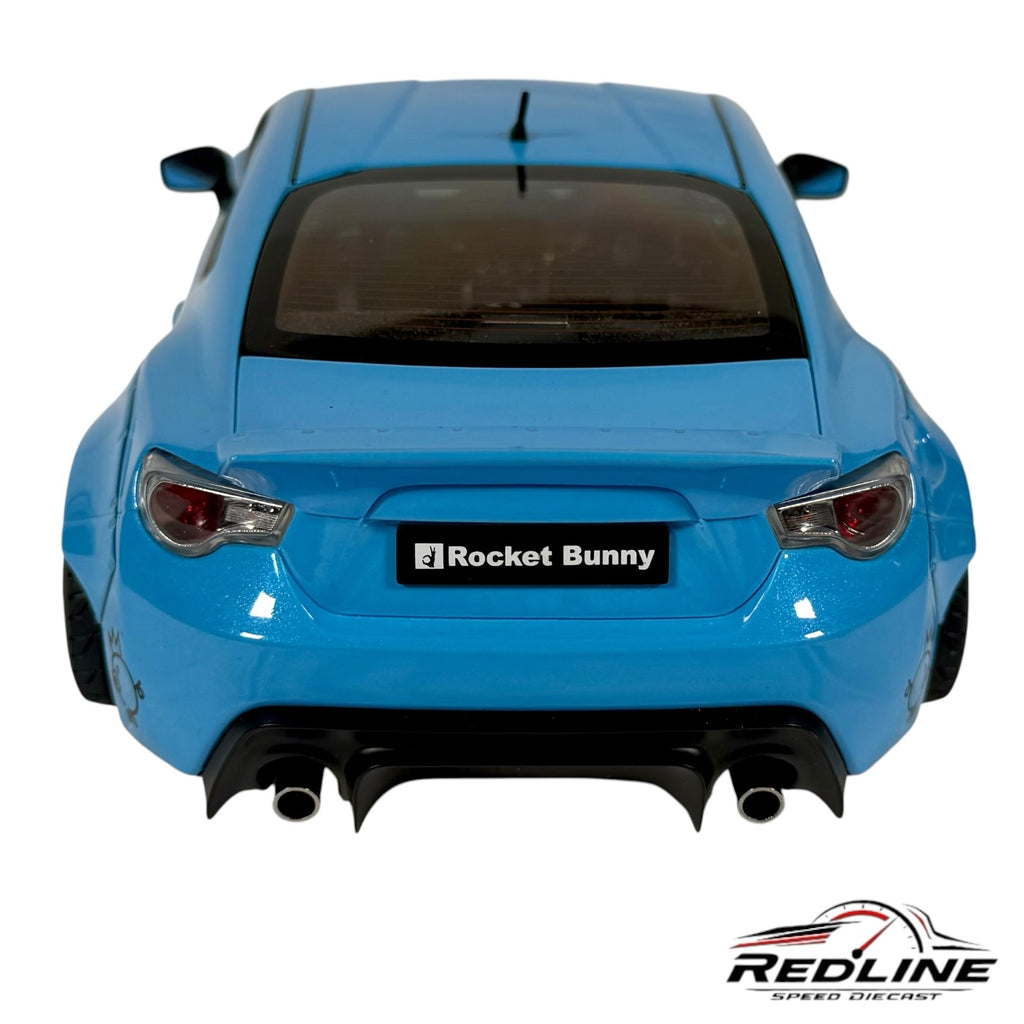 Rear view of a blue Redline Speed Diecast Rocket Bunny widebody sports car model with flared fenders and diffuser.