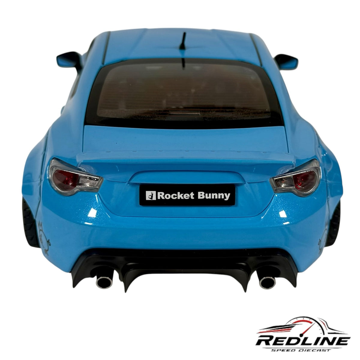 Rear view of a blue Redline Speed Diecast Rocket Bunny widebody sports car model with flared fenders and diffuser.