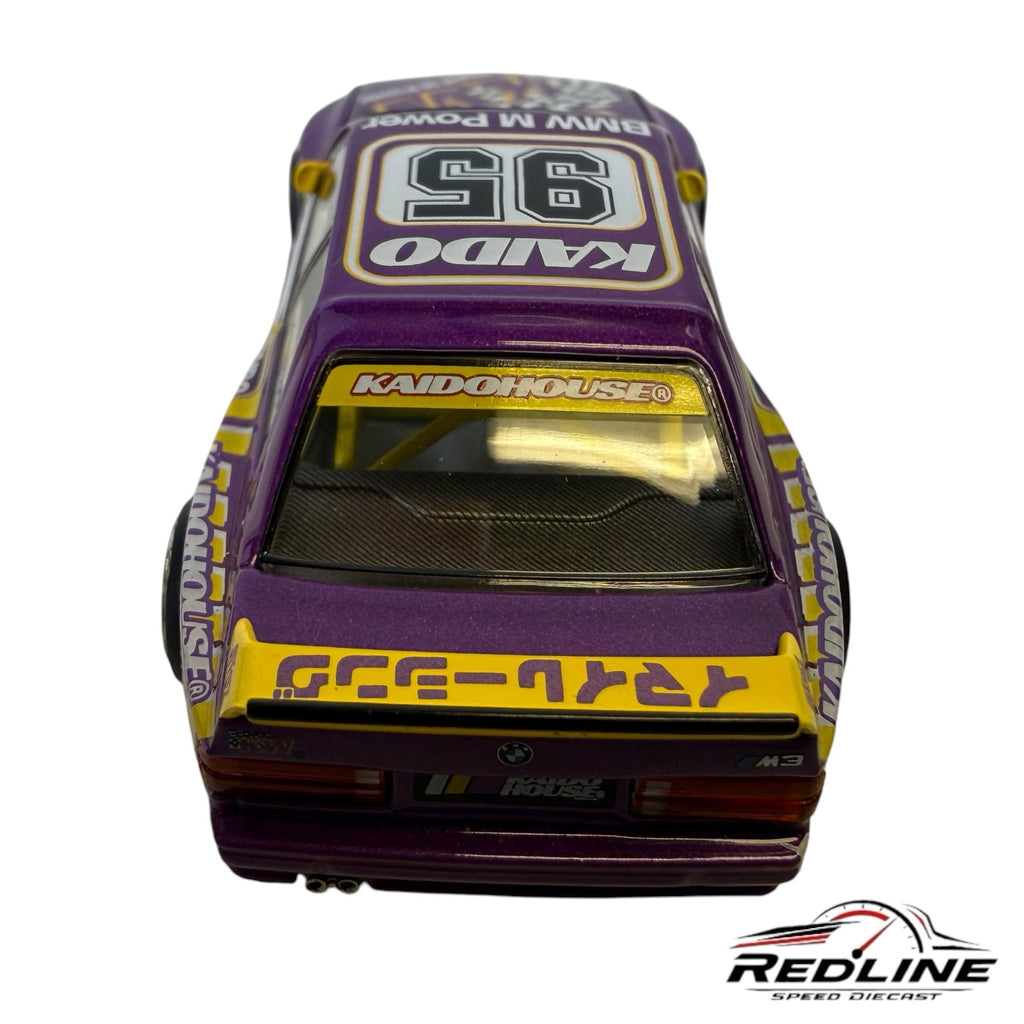Redline Speed Diecast 1:64 scale BMW E30 M3 model car in purple and white with yellow spoiler and race livery