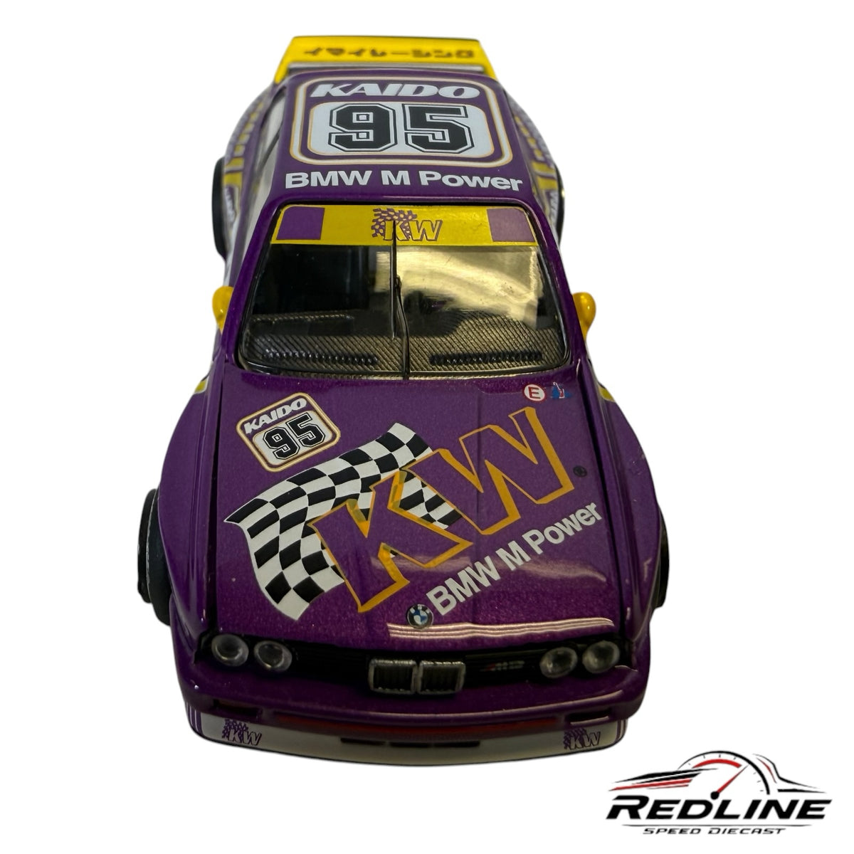 Redline Speed Diecast 1:64 scale BMW E30 M3 model car in purple and white with KW branding and yellow spoiler