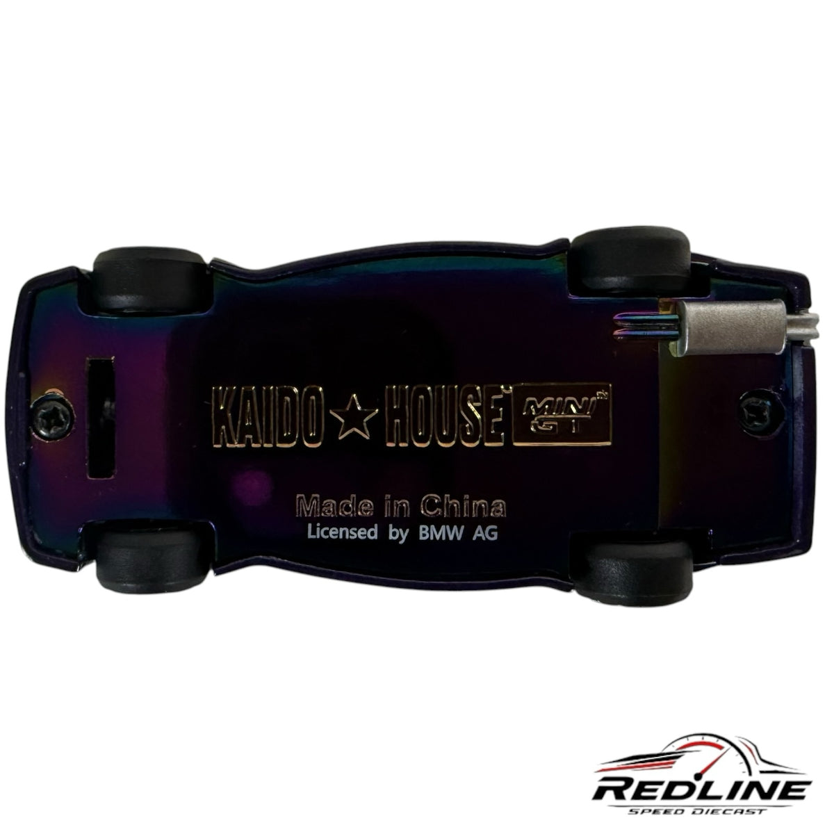Underside of Redline Speed Diecast BMW M3 Kaido GT model featuring an iridescent finish and engraved branding.