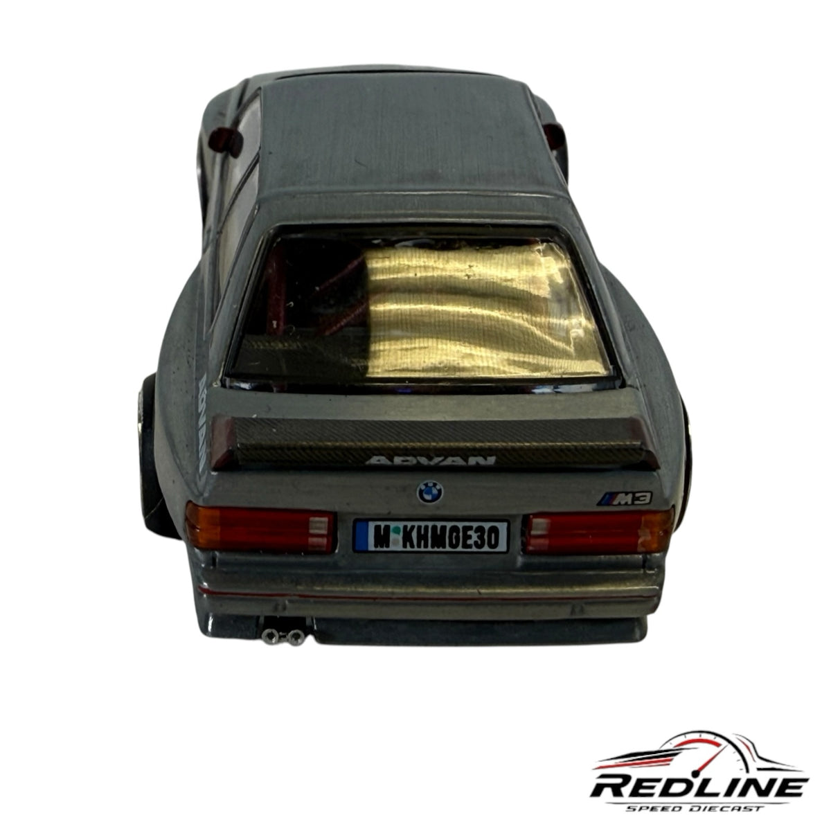 Redline Speed Diecast 1:64 scale BMW M3 model car in brushed metal with widebody kit, Advan branding, and rear spoiler.