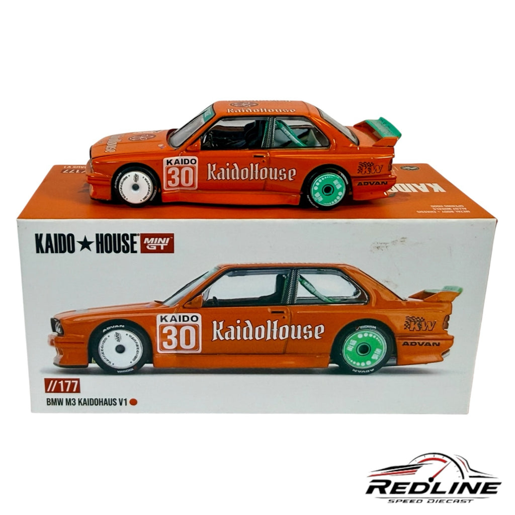 Redline Speed Diecast Kaido House Mini GT BMW M3 V1 in orange with sponsor decals and mismatched wheels on display box