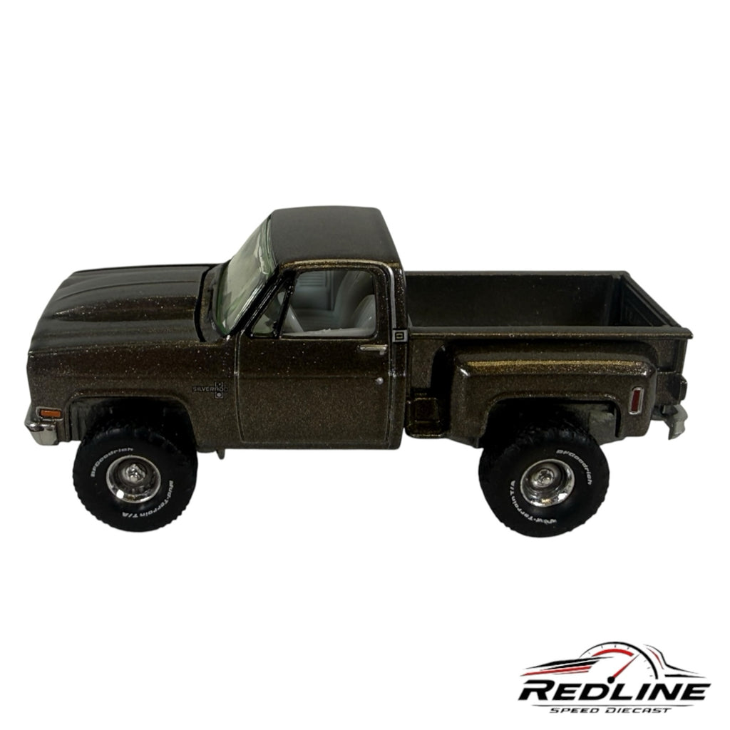 Redline Speed Diecast 1:64 scale metallic brown Chevrolet Silverado stepside pickup truck model with off-road tires.