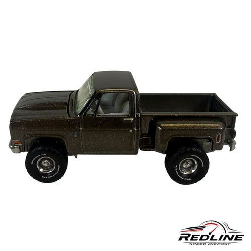Redline Speed Diecast 1:64 scale metallic brown Chevrolet Silverado stepside pickup truck model with off-road tires.