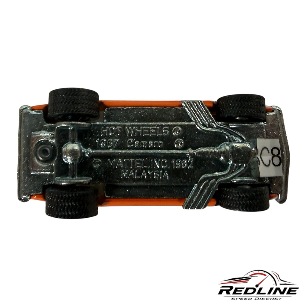 Underside of a Redline Speed Diecast 1967 Chevrolet Camaro model car showing metal chassis and Hot Wheels branding
