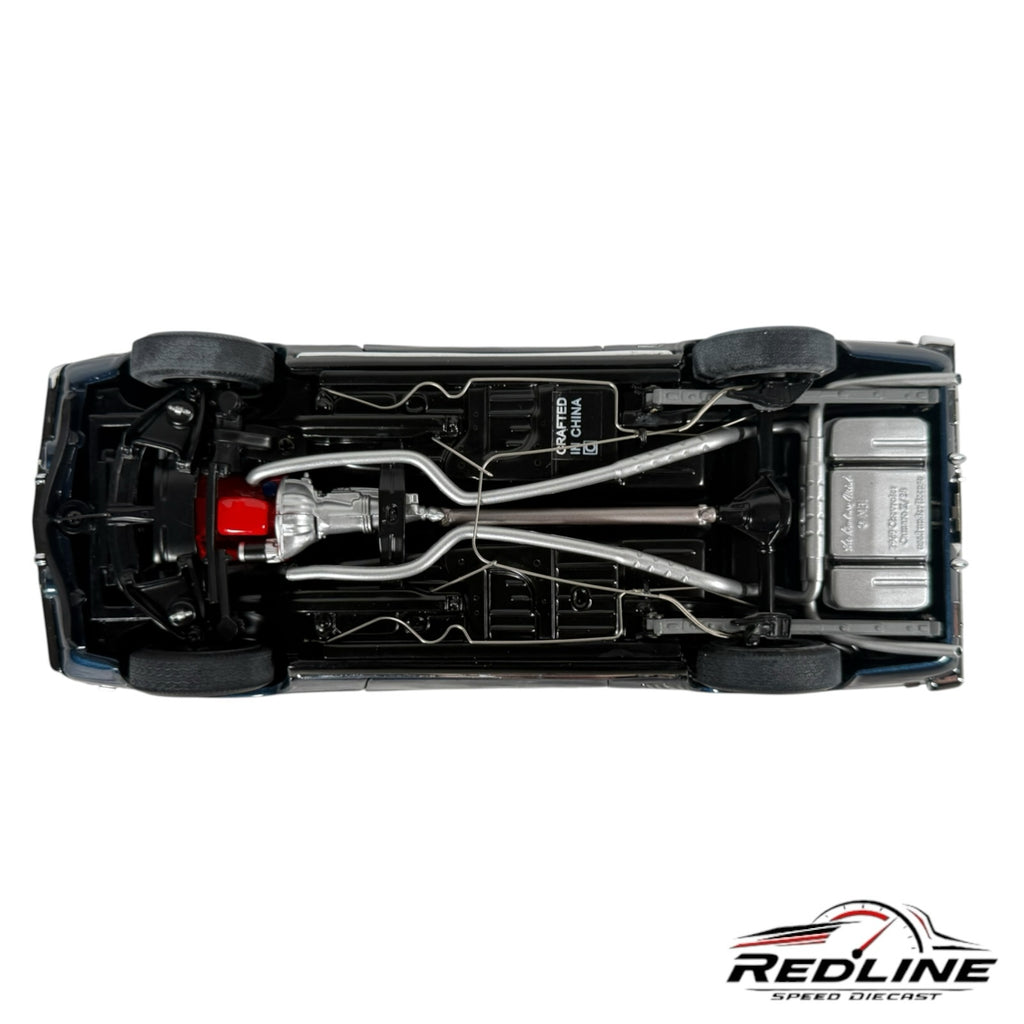 Undercarriage view of a Redline Speed Diecast 1969 Chevrolet Camaro Z/28 model showing detailed exhaust and drivetrain.