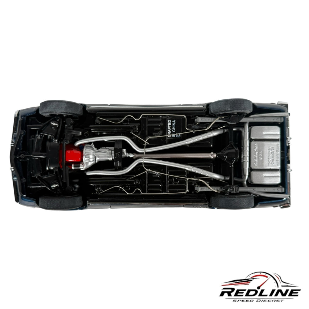 Undercarriage view of a Redline Speed Diecast 1969 Chevrolet Camaro Z/28 model showing detailed exhaust and drivetrain.