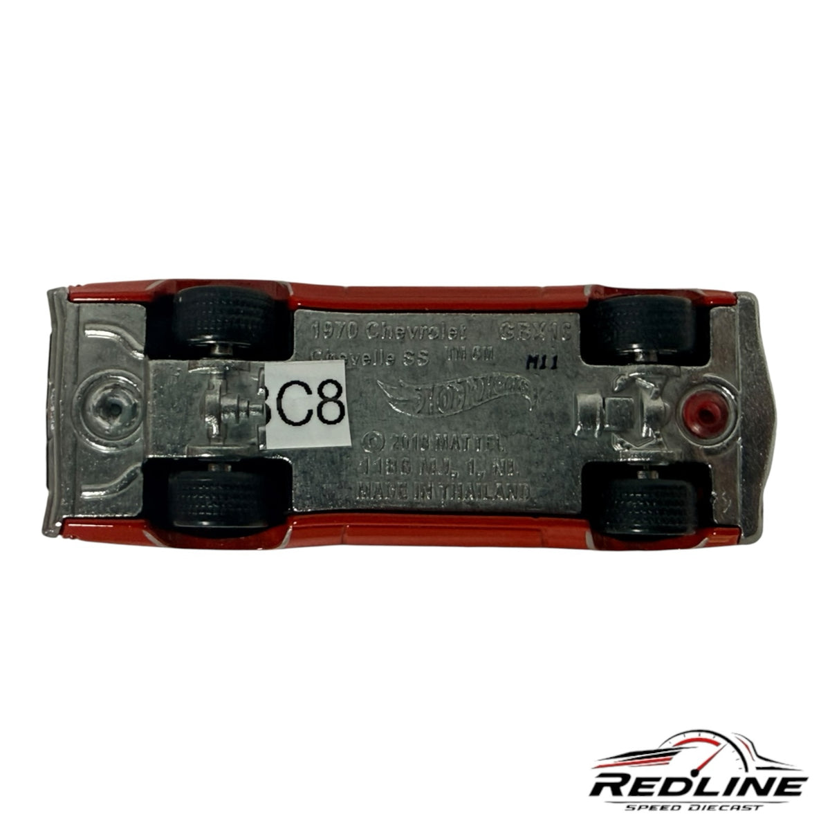 Underside view of a Redline Speed Diecast 1970 Chevrolet Chevelle SS model car showing metal chassis and wheel detail