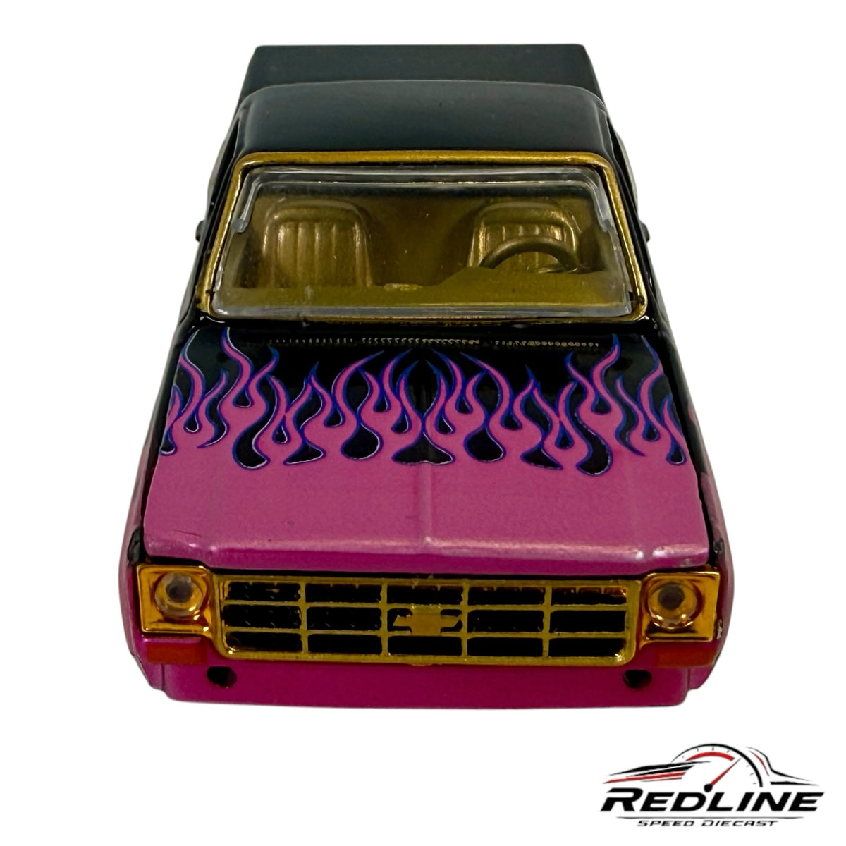 Redline Speed Diecast 1979 Chevrolet C10 truck model in black and pink with purple flames and gold-tone grille trim.