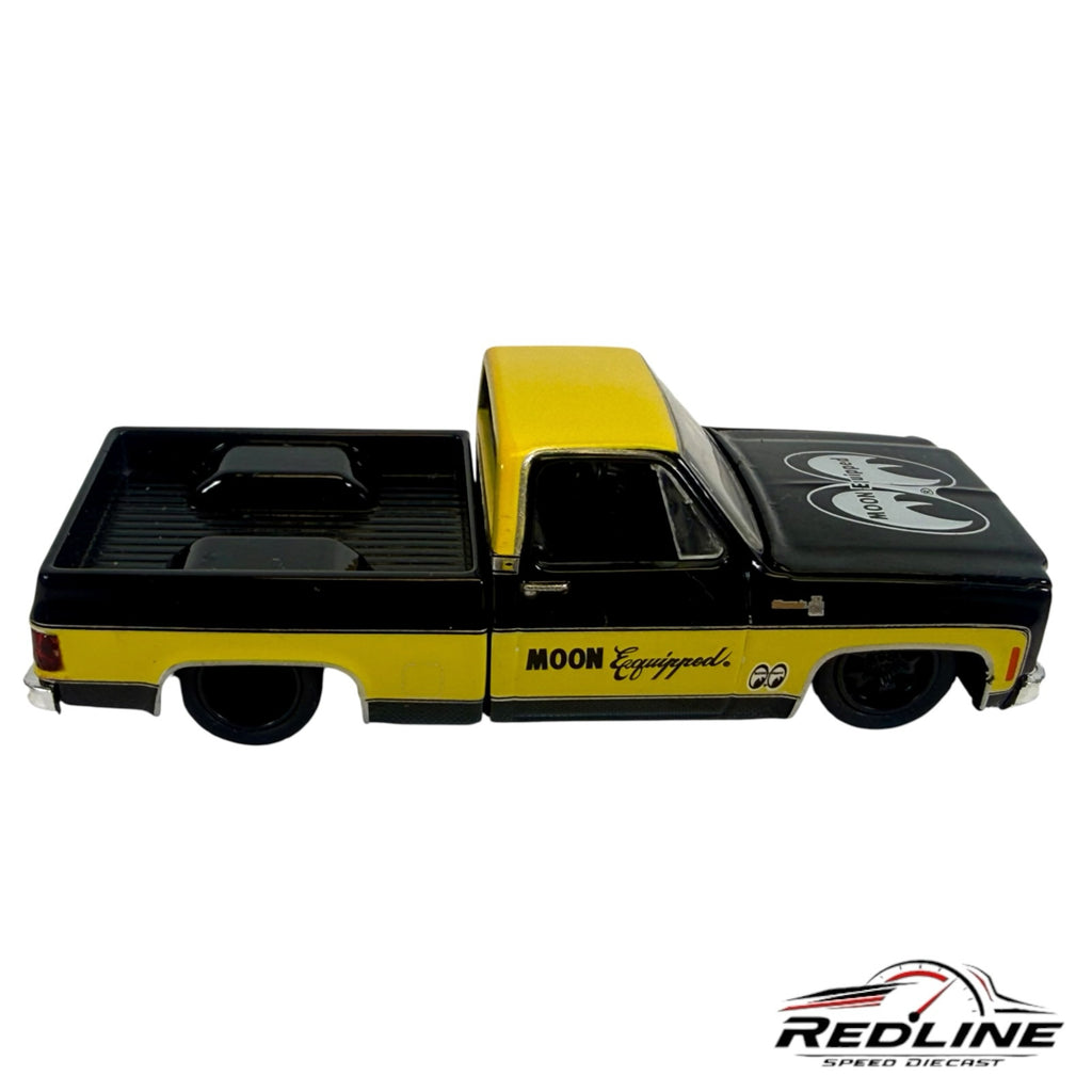 Redline Speed Diecast 1974 Chevrolet C10 pickup truck model in black and yellow with MOON Equipped branding.