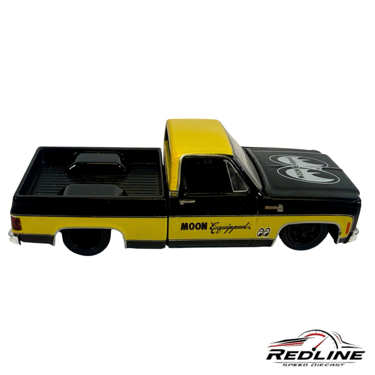 Redline Speed Diecast 1974 Chevrolet C10 pickup truck model in black and yellow with MOON Equipped branding.