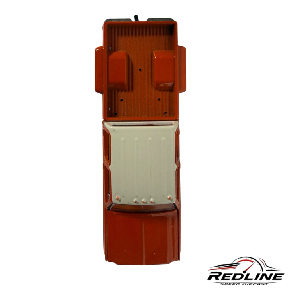 Redline Speed Diecast 1977 Chevrolet C30 dually pickup truck model in orange and white, top-down view.